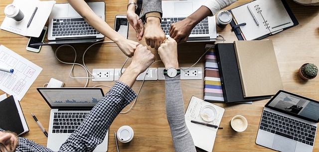 Hands coming together to fist bump.
