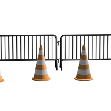 two steel blockades with an orange cone in front of each one.