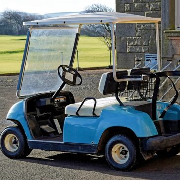 plugged in golf cart with a flat tire
